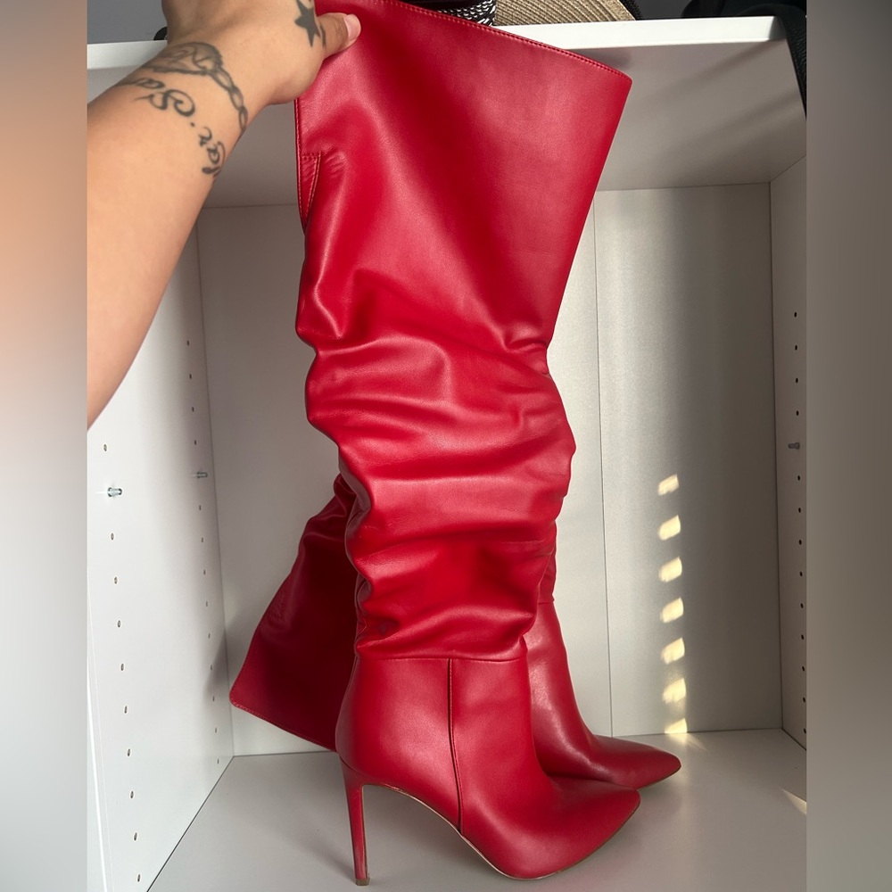 Red knee-high heel boots